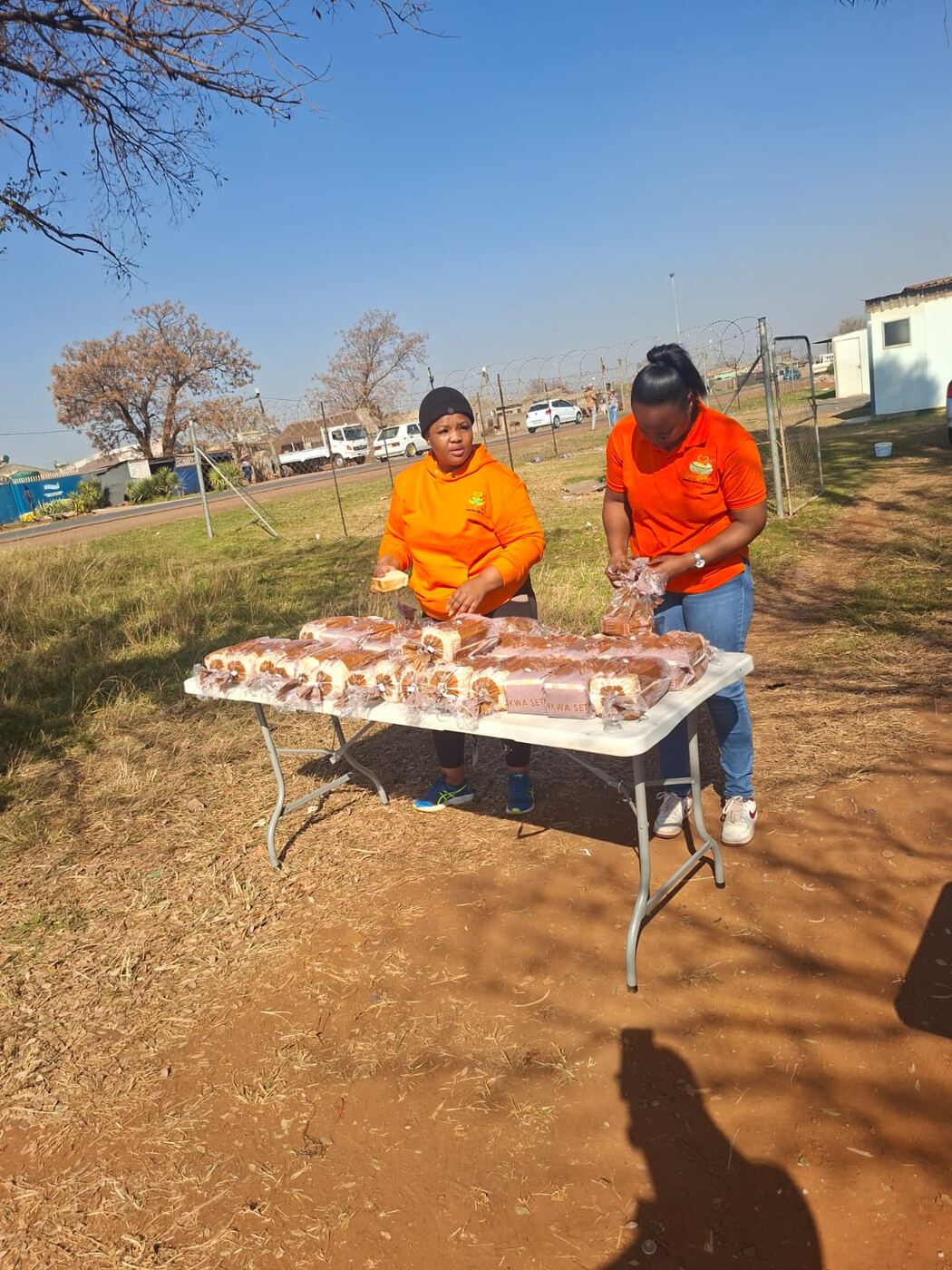 Spoon of Hope volunteers packing bread parcels for distribution
